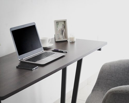 Person standing up from their office chair