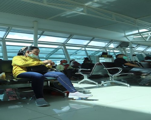 Person doing a light stretch while waiting