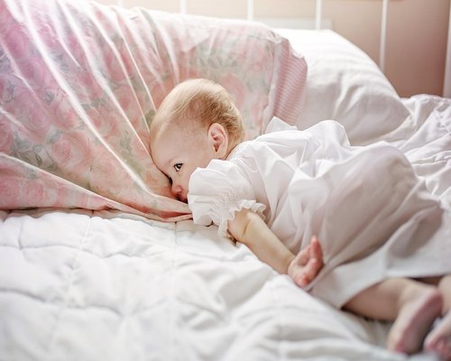 Person sleeping peacefully in a comfortable bed