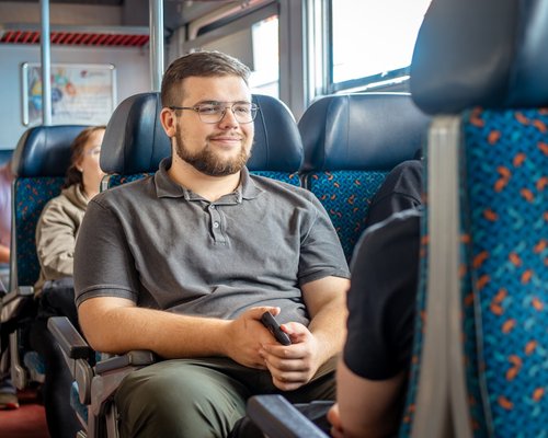 Commuter sitting comfortably on public transport